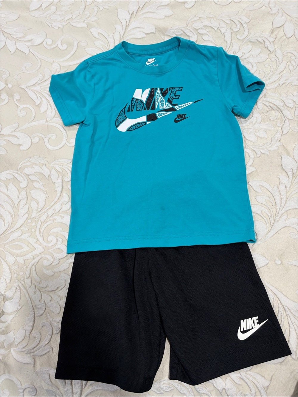 Nike Teal Graphic Tee with Black Athletic Shorts. Light stain as pictured.